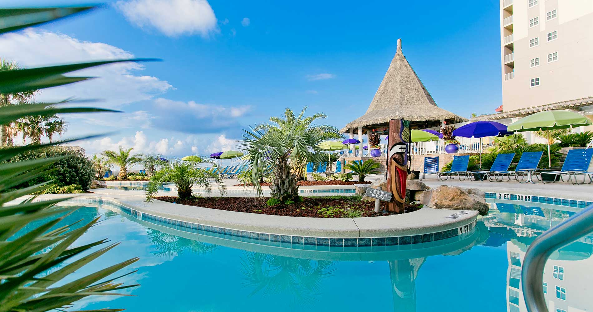 tropical pool beside hotel